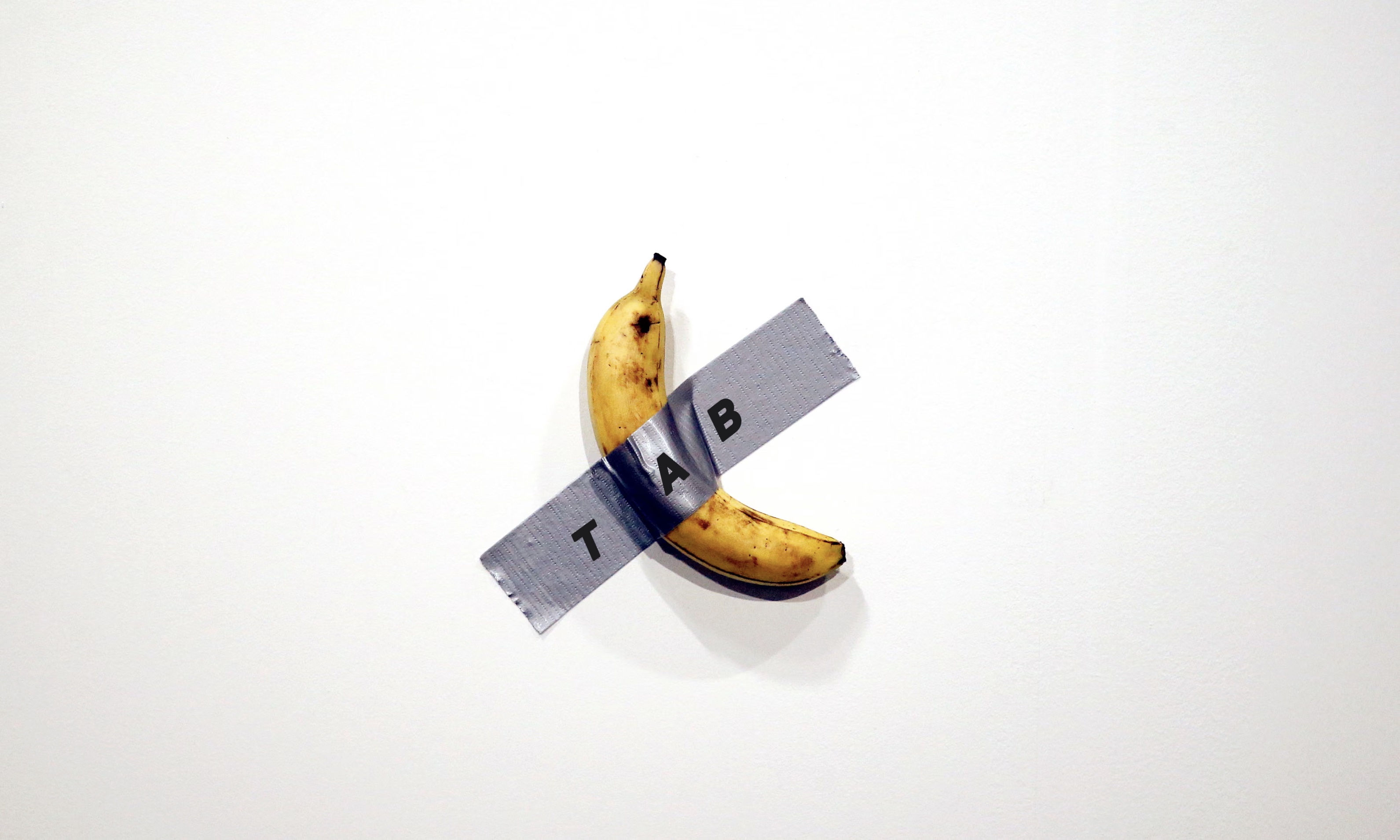 A banana duct-taped to a gallery wall; the tape reads SPLIT